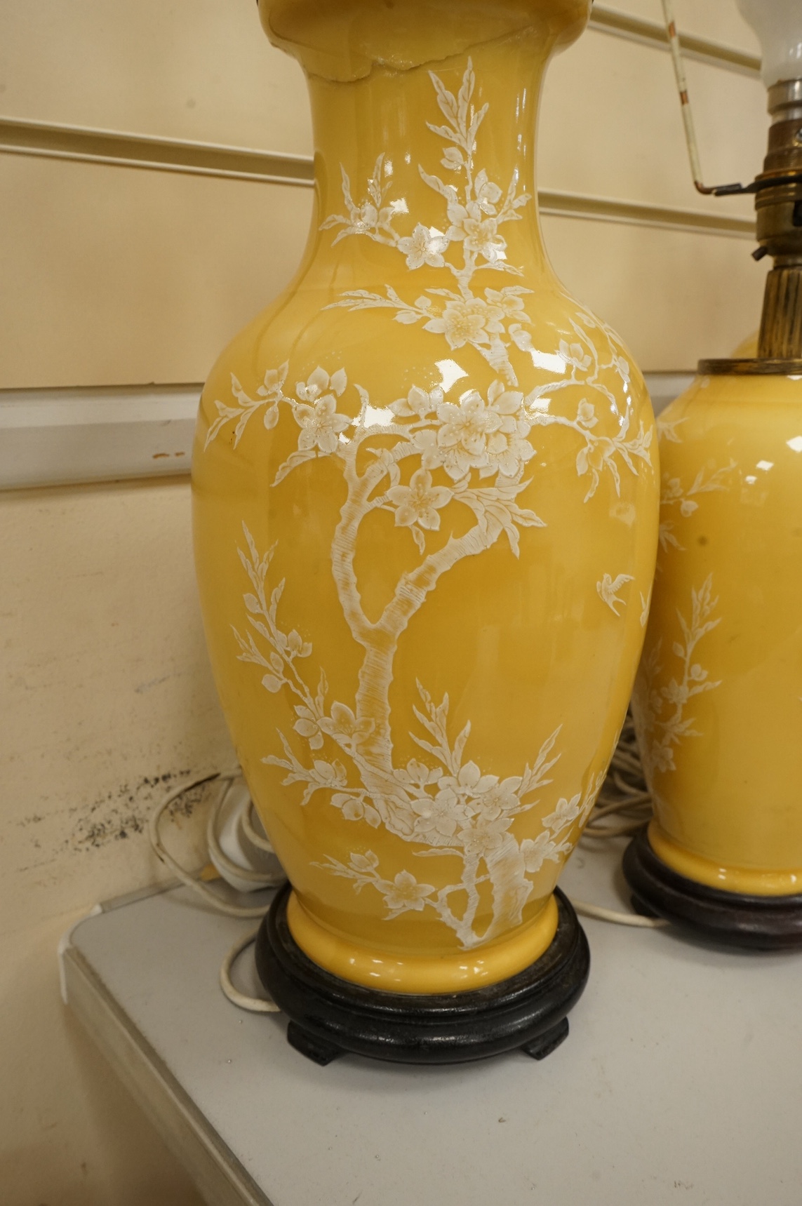 A garniture of three Chinese yellow ground lamp bases, pair 40cm high. Condition - fair